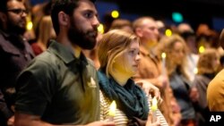 People gather to pray for the victims of the mass shooting during a candlelight vigil in Thousand Oaks , Calif., Nov. 8, 2018.