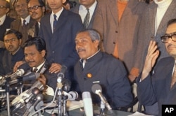 FILE - Bangladeshi leader Sheik Mujibur Rahman (C) is shown during a press conference at the Hotel Claridges in London, England, Jan. 8, 1972.