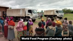 People affected by Cyclone Jude wait for relief items in Mulanje district, Malawi, on March 13, 2025.
