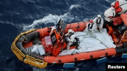 A Medecins Sans Frontieres, or Doctors Without Borders, team retrieves bodies of migrants, in body bags, from the Mediterranean Sea on June 7, 2024. (MSF via Reuters)