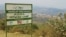 FILE - Picture showing the entrance placard of the Kiziba camp in western Rwanda, Sept. 6, 2016.