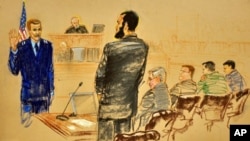 Omar Khadr (with beard) before a US military commission, 25 Oct. 2010