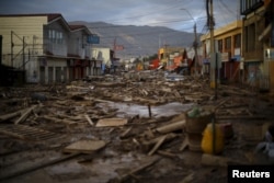 The main street is covered with debris in town of Chanaral, March 26, 2015.