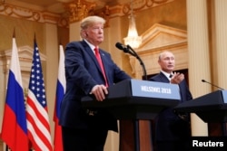 Russia's President Vladimir Putin gestures during a joint news conference with U.S. President Donald Trump after their meeting in Helsinki, Finland, July 16, 2018.