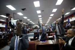 Haitian deputies ask for the floor after the speech of appointed Prime Minister Fritz William Michel to present his general policy at the Parliament in Port-au-Prince, Haiti, September 3, 2019.