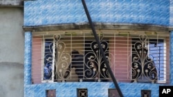 Bangladeshi police inspect a two-story house after a raid in Narayanganj, in the outskirts of Dhaka, Aug. 27, 2016.
