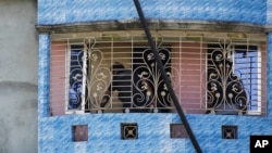Bangladeshi police inspect a two-story house after a raid in Narayanganj, in the outskirts of Dhaka, Aug. 27, 2016.