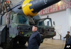 FILE - An undated still image broadcast in a news bulletin by North Korea's KRT May 15, 2017, shows leader Kim Jong Un at what was said to be a missile test site at an undisclosed location in North Korea.
