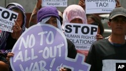  Protesters rally outside Camp Aguinaldo, the general headquarters of the Philippine armed forces, to protest alleged "all-out war" being waged by the military and police against communist rebels following the recent collapse of the peace talks, March 7, 2017.