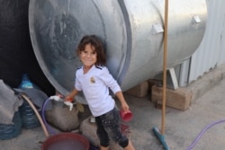 When IS took child slaves, they re-named them. This girl, pictured in Khanke, Kurdistan region, Iraq, on Sept. 28, 2019, was born in captivity. Her mother later gave her the name Mukhaban, which means "sorrow." (Heather Murdock/VOA)