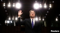 U.S. Supreme Court nominee judge Brett Kavanaugh is sworn in during a Senate Judiciary Committee confirmation hearing on Capitol Hill in Washington, Sept. 4, 2018.