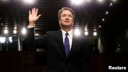 U.S. Supreme Court nominee judge Brett Kavanaugh is sworn in during a Senate Judiciary Committee confirmation hearing on Capitol Hill in Washington, Sept. 4, 2018.