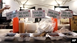 FILE - A selection of dishes is seen on display at a food stall at the Asian Garden Mall in Westminster, California, Sept. 5, 2015.