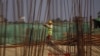 FILE - A man works at the site of the Thilawa Special Economic Zone (SEZ) project at Thilawa, Myanmar, May 8, 2015. 