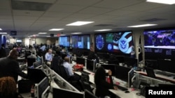FILE - U.S. Department of Homeland Security election security workers monitor screens in the DHS National Cybersecurity and Communications Integration Center (NCCIC) in Arlington, Virginia, U.S. November 6, 2018. 