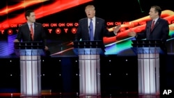 During a Republican presidential candidates' debate, businessman Donald Trump, center, reacts to Texas Sen. Ted Cruz, right, as Florida Sen. Marco Rubio looks on, in Houston, Texas, Feb. 25, 2016.