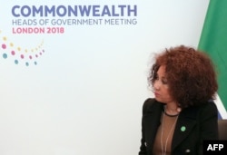 FILE - South African Minister of International Relations and Co-operation, Lindiwe Sisulu, listens during bilateral talks with Britain in central London, April 17, 2018.