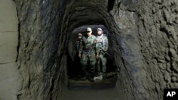 Afghan Special Forces inspect inside a cave which was used by suspected Islamic State militants at the site where a MOAB, or ''mother of all bombs'', struck the Achin district of the eastern province of Nangarhar, Afghanistan April 23, 2017. 
