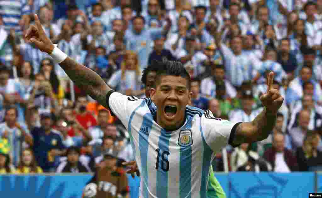 Argentina's Marcos Rojo celebrates after scoring against Nigeria at the Beira Rio stadium in Porto Alegre, June 25, 2014.