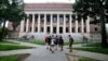 FILE - Students walk near the Widener Library in Harvard Yard at Harvard University in Cambridge, Mass., Aug. 13, 2019.