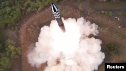 A view of a test launch of a new solid-fuel intercontinental ballistic missile (ICBM) Hwasong-18 at an undisclosed location in this still image of a photo used in a video released by North Korea's Korean Central News Agency (KCNA) April 14, 2023. 