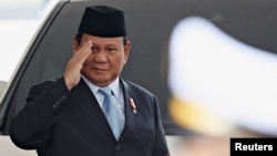 FILE - Indonesian President-elect Prabowo Subianto gestures as he attends the annual State of the Nation Address at the parliament building, ahead of the country's Independence Day, in Jakarta, Indonesia, August 16, 2024. 