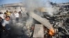 People gather as a Palestinian man reacts next to the rubble of his house, which witnesses said was destroyed in an Israeli air strike, in Rafah in the southern Gaza Strip Aug. 20, 2014.