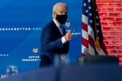 FILE - President-elect Joe Biden departs a news conference after introducing his nominees and appointees to economic policy posts at The Queen theater, Tuesday, Dec. 1, 2020, in Wilmington, Del.