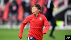 Washington Spirit forward Kumi Yokoyama (17) warms up prior to an NWSL Challenge Cup soccer match against the Racing Louisville FC, Thursday, April 15, 2021, in Washington. (AP Photo/Will Newton)