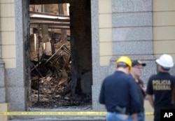 Federal police investigate the cause of the fire that tore through Brazil's National Museum in Rio de Janeiro, Sept. 5, 2018.