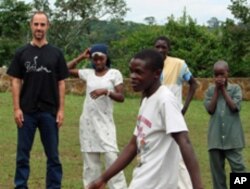 Justin Silbaugh with students in Uganda
