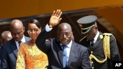 FILE - Congolese President Joseph Kabila, center, waves as he and others celebrate independence for the Democratic Republic of Congo in Kindu, Congo. 