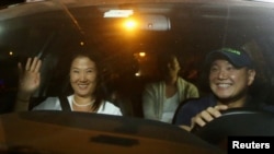 FILE - Keiko, Sachi and Hiro Fujimori, daughters and son of former President Alberto Fujimori arrive to visit their father after Peruvian President Pedro Pablo Kuczynski pardoned him, at Centenario hospital in Lima, Peru, Dec. 24, 2017.