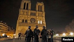 Police patrol near Notre Dame Cathedral following a series of deadly attacks in Paris, Nov. 14, 2015.