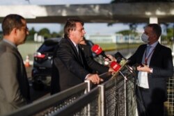 Brazil's President Jair Bolsonaro speaks to the media at the Alvorada Palace, amid the coronavirus outbreak, in Brasilia, Brazil, March 10, 2021.