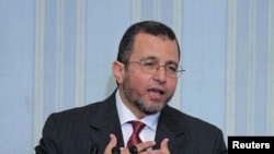 Egypt's new Prime minister, Hisham Qandil, speaks during his first news conference in Cairo, August 2, 2012. 
