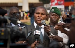 FILE - Faustin-Archange Touadera (C) is seen speaking to the media in downtown Bangui, Central African Republic, Jan. 5, 2013.