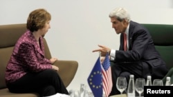 U.S. Secretary of State John Kerry (R) meets with European Union High Representative Catherine Ashton before a meeting of EU ministers of foreign affairs at the National Gallery of Art in Vilnius, Sept. 7, 2013.