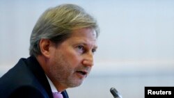 FILE - European Neighborhood Policy and Enlargement Negotiations Commissioner-designate Johannes Hahn of Austria addresses the European Parliament's Committee on Foreign Affairs, at the EU Parliament in Brussels, September 30, 2014