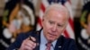 U.S. President Joe Biden adjusts his microphone during a meeting with the President's Council of Advisors on Science and Technology in the State Dining Room of the White House, April 4, 2023, in Washington. 