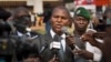 FILE - Faustin-Archange Touadera (C) is seen speaking to the media in downtown Bangui, Central African Republic, Jan. 5, 2013.