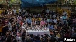 Indian wrestlers Vinesh Phogat, Bajrang Punia, and Sakshi Malik address a news conference as they take part in a sit-in protest demanding the arrest of the Wrestling Federation of India President, who they accuse of sexually harassing female players, in New Delhi, India, April 24, 2023.