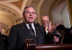 FILE - Sen. Bob Menendez, D-N.J., the ranking member of the Senate Foreign Relations Committee, talks to reporters on Capitol Hill in Washington, June 12, 2018.