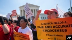 Demonstrators gather at the Supreme Court as the justices finish the term with decisions on gerrymandering and a census case involving a bid by the Trump administration to ask everyone about their citizenship status in the 2020 census, July 27, 2019.