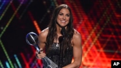 Alex Morgan, a member of the U.S women's national soccer team, accepts the award for best female athlete at the ESPY Awards, July 10, 2019, at the Microsoft Theater in Los Angeles. 