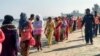 Members of the coast guard escort Rohingya refugees after their boat capsized, in Teknaf, near Cox's Bazar, Bangladesh, Feb. 11, 2020.