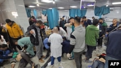 FILE - Victims are treated inside the Kamal Adwan hospital in Beit Lahiya in the northern Gaza Strip, following Israeli strikes around the medical complex on Dec. 6, 2024