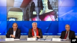Qadri Jamil, left, former deputy prime minister representing Syria's opposition Popular Front of Change and Liberation, Samir Aita, center, a member of Syrian Democratic Forum, and Suleiman Numrud, an independent Syrian opposition member, attend a news conference in Moscow, Russia, April 10, 2015.