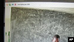 The One Laptop Per Child website shows students in Kenya using the small green and white computer, March 2011