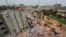FILE - A view of rescue workers attempting to find survivors from the rubble of the collapsed Rana Plaza building in Savar, Bangladesh, April 30, 2013.